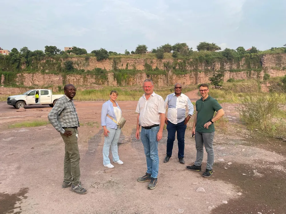 TMS team members and their hosts standing in a quarry in the Democratic Republic of the Congo