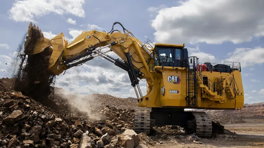 Mining excavator loading a haul truck in an open pit