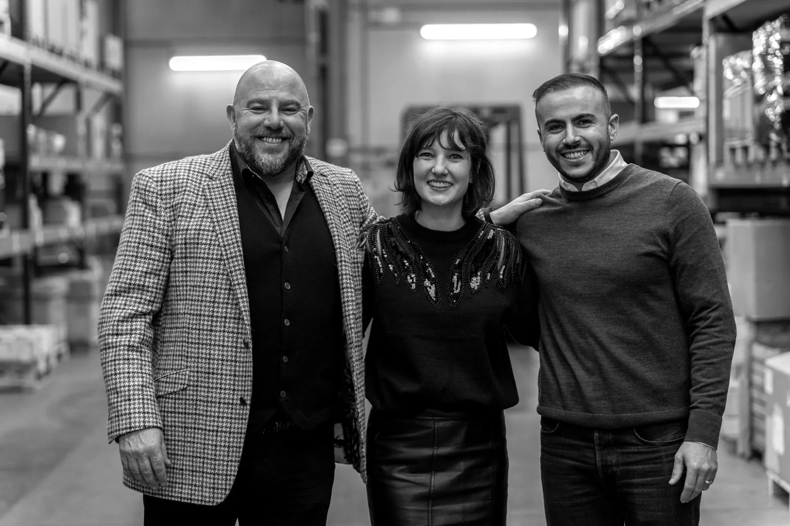 John Rogerson, Flore Mareschal and Tuncay Bayram, the three shareholders of TMS, standing together in the Alleur warehouse